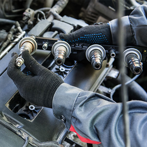 man repairing the car engine